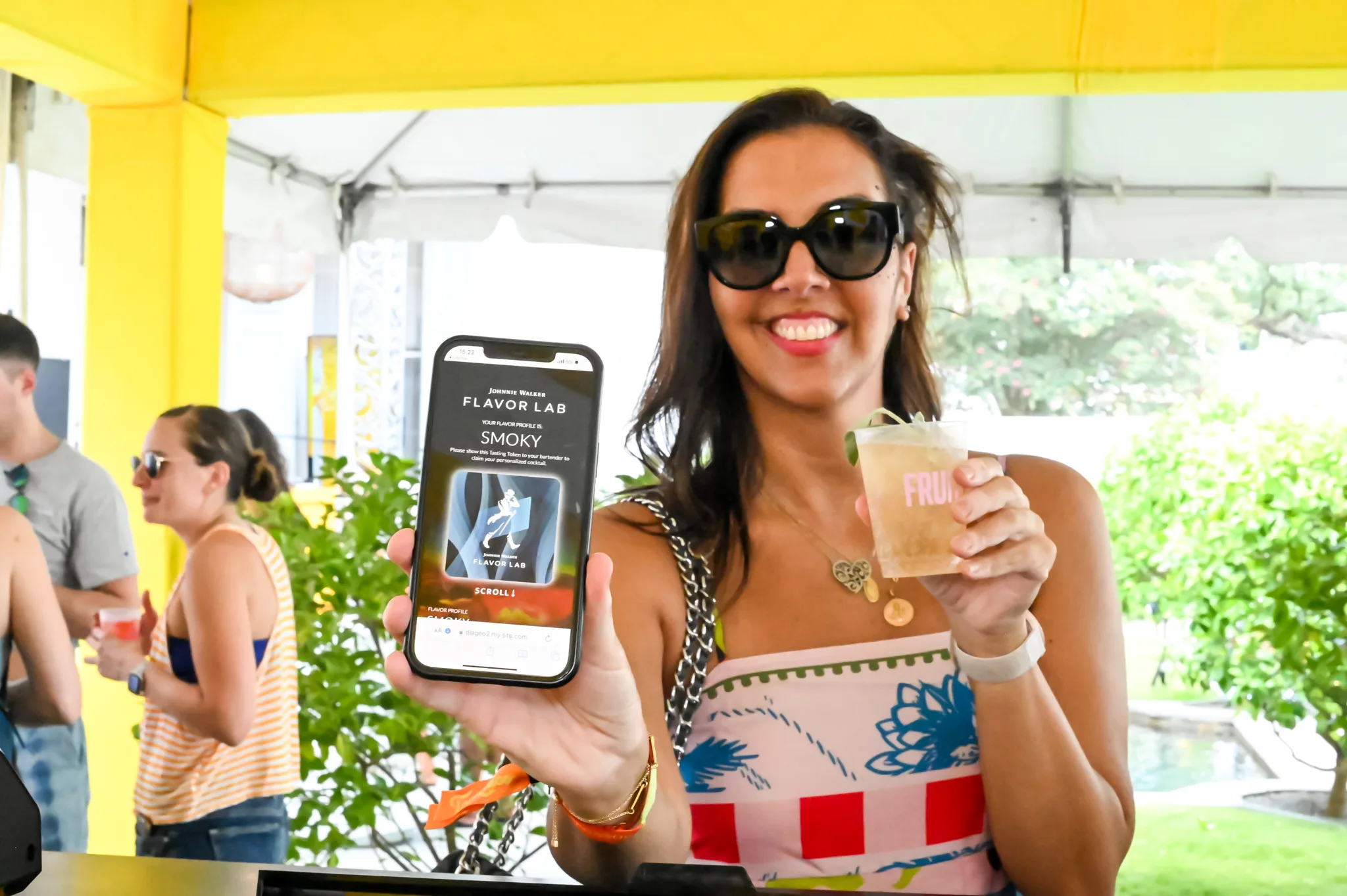 House of Walker guest showing a collected digital collectible on their phone