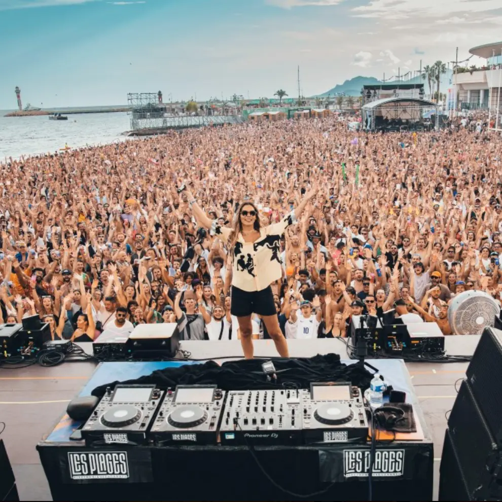 Les Plages Électroniques DJ facing the festival crowd in Cannes